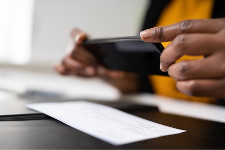 person depositing check with phone