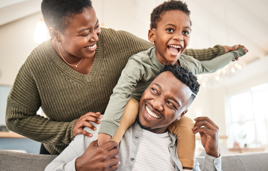 mom dad and kid on dad's shoulders