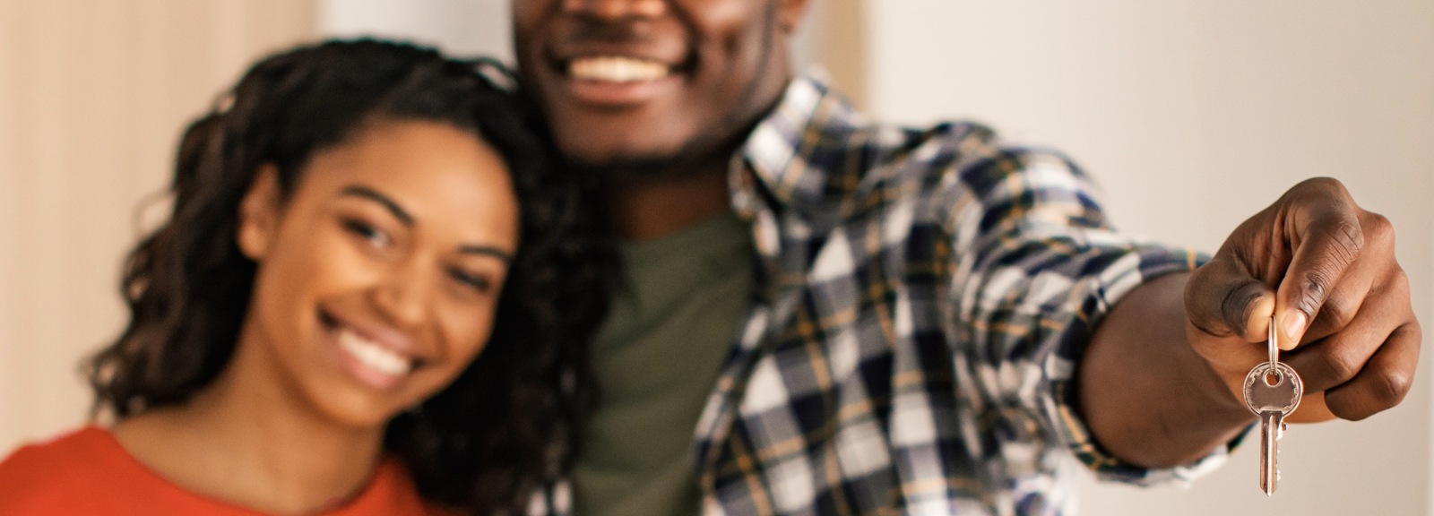 couple holding key