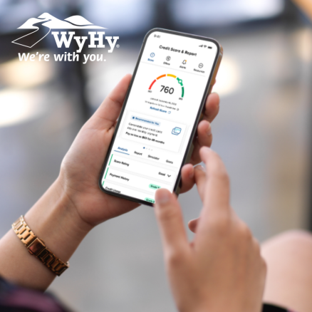 Woman using WyHy's SavvyMoney® free credit monitoring tool through WyHy's Mobile Banking.